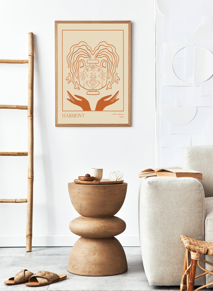 Artistic illustration of a heart with hands holding it, titled 'Harmony' by Arty Guava 2024. Harmony by Arty Guava is a minimalist vessel art print with terracotta linework, mirrored figures, and symbolic calm. Officially licensed wall poster.