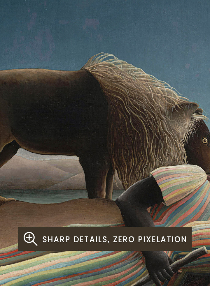 A framed surreal art print depicting a lion standing over a sleeping person wrapped in a striped blanket, with a guitar, vase, and full moon in a night sky. The Sleeping Gypsy by Henri Rousseau is a vintage art print featuring a sleeping traveler, lion, moonlit desert, striped robe, mandolin, and deep blue night sky.
