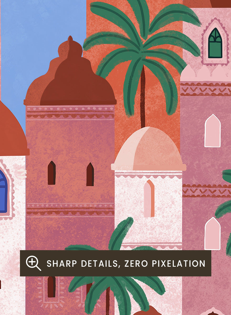 A framed art print featuring a stylized illustration of a coastal city with pink and peach buildings, green palm trees, and a blue sky. Arabian Fantasy City by Ceyda Alasar travel art print featuring ornate domes, arches, palm trees, patterned facades, and colorful desert architecture.