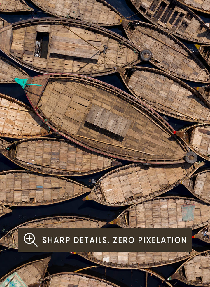 Framed artwork of a pattern made from wooden boats. Wooden Boats by Azim Khan Ronnie aerial photography print showing clustered wooden boats from above, textured pattern wall art poster