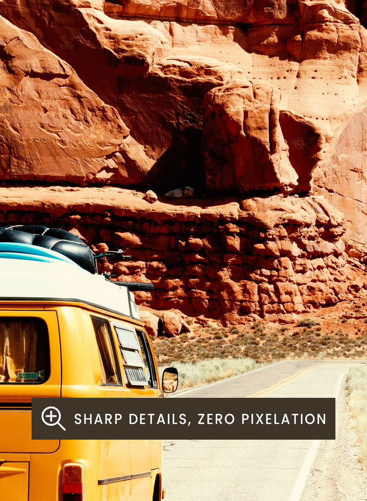 Van on a road with a surreal landscape and optical illusion pattern. The Real Road Trip by Taudalpoi surreal desert road trip art print with vintage van, red rock canyon and hypnotic cosmic sky, retro sci fi poster wall art.