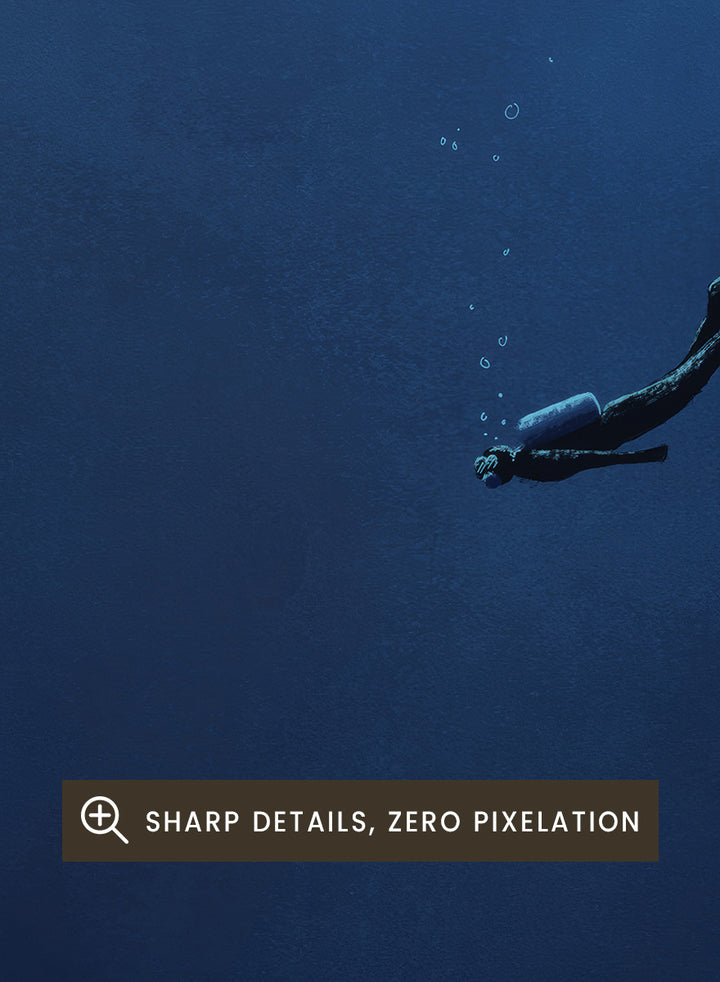A framed art print featuring a dark blue underwater scene with a diver floating in the center, flanked by glowing blue rock formations. Shop Deep Blue Diver by Jake Waldron, a minimalist diving wall art print featuring a lone deep-sea diver, underwater cliffs, and dramatic navy blue tones.
