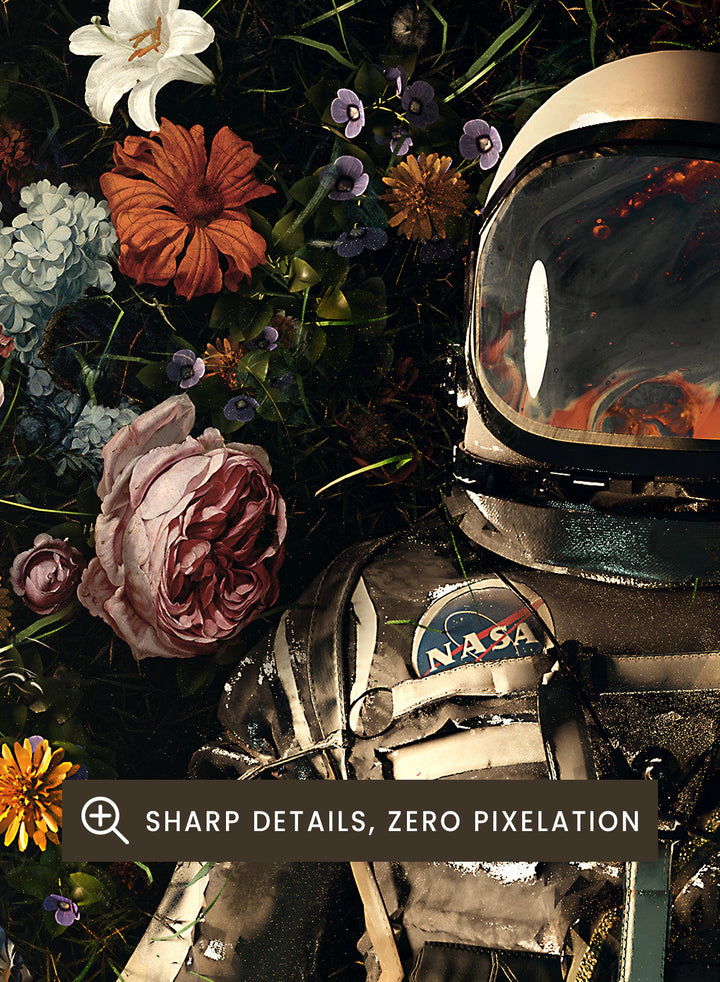 Person in a spacesuit lying on a bed of flowers with a dark background. Cosmic Floral Dream by Nicebleed is a surreal astronaut floral art print featuring a space figure surrounded by flowers, modern aesthetic wall poster.