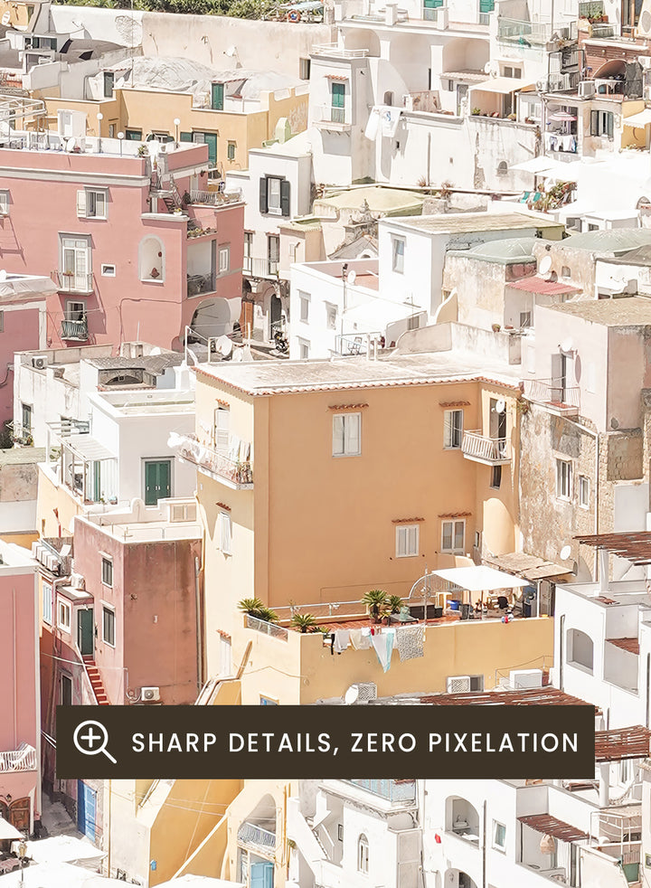 Colorful coastal town with boats docked along a waterfront. Colorful Italian Harbor by Henrike Schenk is a coastal photography print featuring pastel waterfront architecture, fishing boats, turquoise waters, and Mediterranean charm.