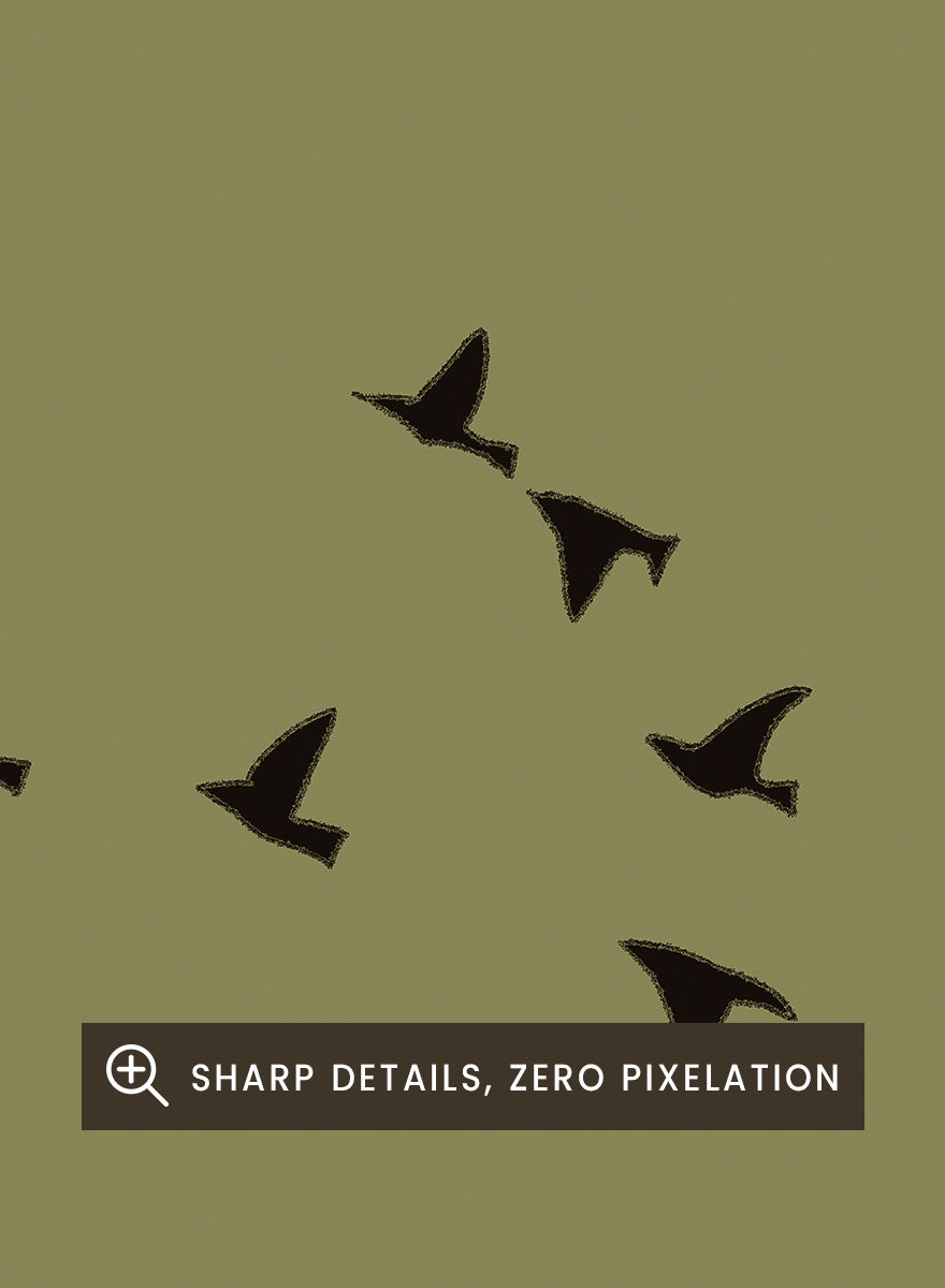 Minimalist art print featuring a large olive green circle with small black bird silhouettes flying across it, set against a warm beige background. Graceful Birds Soaring by The Art Concept is a minimalist bird art print featuring black birds in flight across an olive green circle and warm cream background.