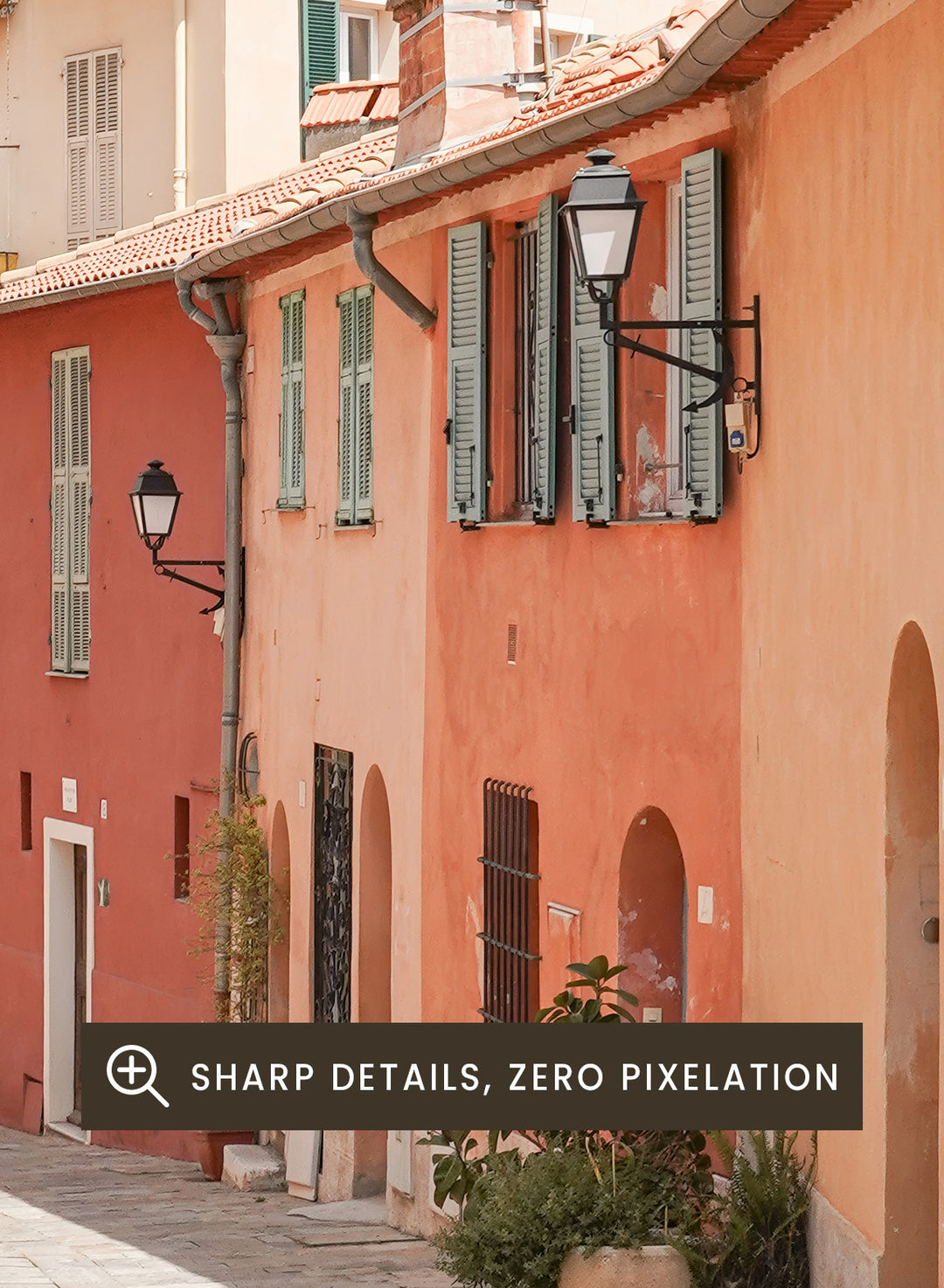Tiled street with colorful buildings and greenery under a clear blue sky. Colorful Old Town Street by Henrike Schenk is a European travel photography print featuring Mediterranean architecture, pastel buildings, and street wall art.