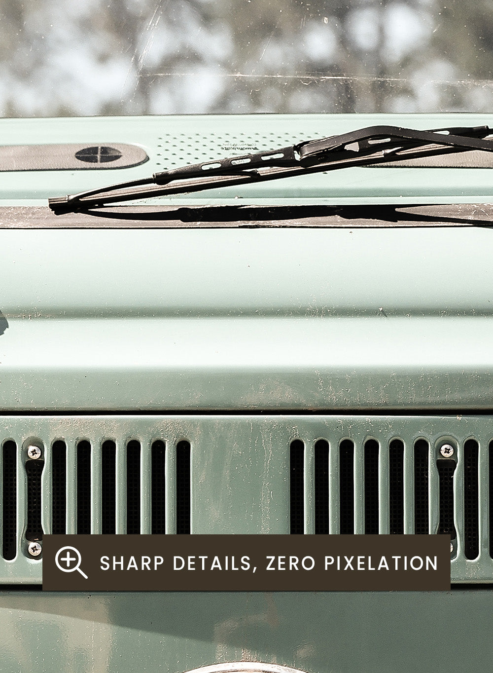 Front view of a vintage green Volkswagen van with clear sky background. Classic Design In Soft Green Tones by Shot by Clint car art print featuring a vintage Volkswagen camper van in soft sage green and warm sunlight.