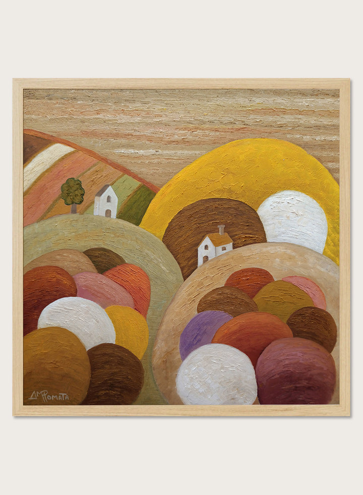 A framed abstract landscape painting featuring stylized hills, rolling forms, small houses, and a large yellow circular shape. Shop Colorful Hillside Village by Angeles M. Pomata, an autumn landscape art print featuring rounded hills, tiny white houses, earthy tones, and rich oil texture.