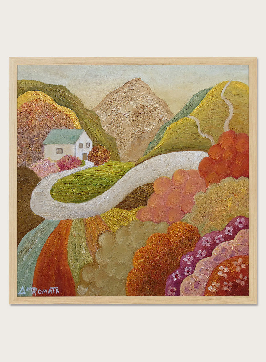A framed landscape painting featuring a winding white road through colorful hills, a small white house, and a mountain in the background. Shop Colorful Hillside Home by Angeles M. Pomata, an autumn landscape art print featuring a winding road, white country house, rolling hills, and wildflowers.