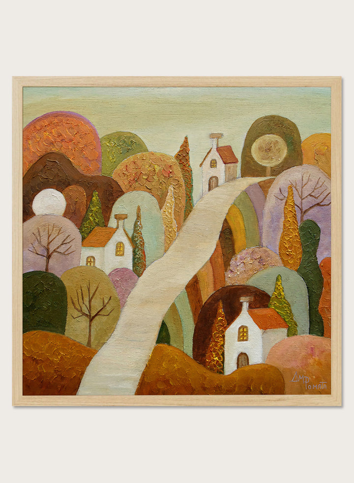 A framed landscape painting featuring stylized white houses, a winding cream path, and rolling hills in earthy tones of brown, orange, green, and purple. Shop Whimsical Village Path by Angeles M. Pomata, an autumn landscape art print featuring a winding road, white village houses, rounded hills, and warm earthy tones.
