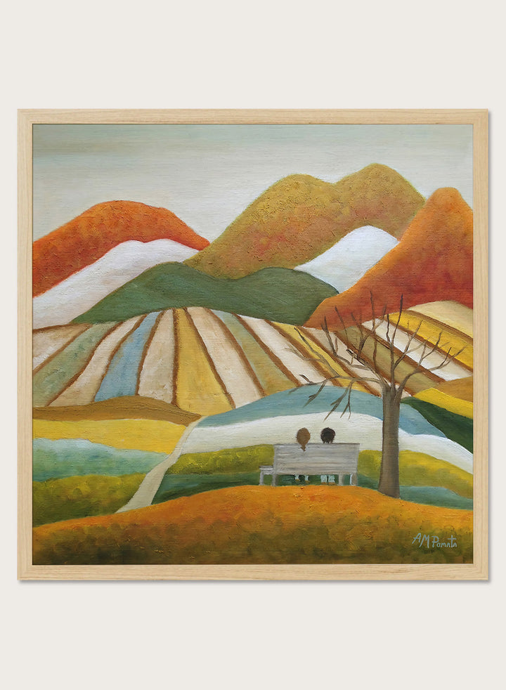 A framed landscape painting featuring stylized mountains, striped fields, a bench with two figures, and a bare tree. Shop Couple On Autumn Bench by Angeles M. Pomata, an autumn landscape and figurative art print featuring a seated couple, rolling hills, patchwork fields, and warm fall tones.