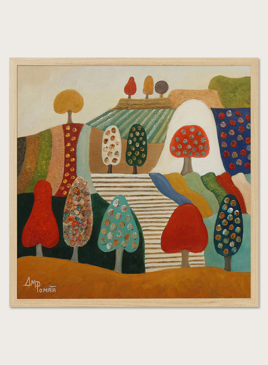 A framed abstract landscape painting featuring stylized trees, hills, and geometric shapes in red, blue, green, yellow, beige, and brown tones. Shop Whimsical Tree Landscape by Angeles M. Pomata, a colorful landscape art print featuring patterned trees, patchwork hills, and warm autumn tones.
