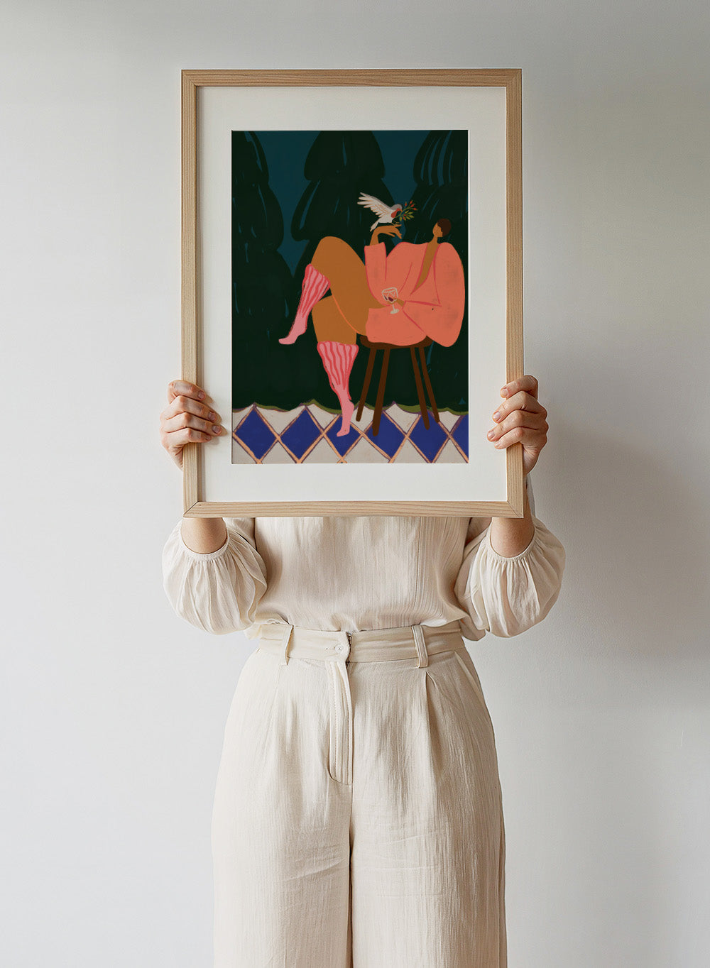 Illustration of a person in a pink dress sitting on a stool with a glass of wine, holding a dove with an olive branch. A Lil Birdy Told Me by Arty Guava is a modern woman art print with a bird, pink robe, and bold color. Officially licensed wall poster.