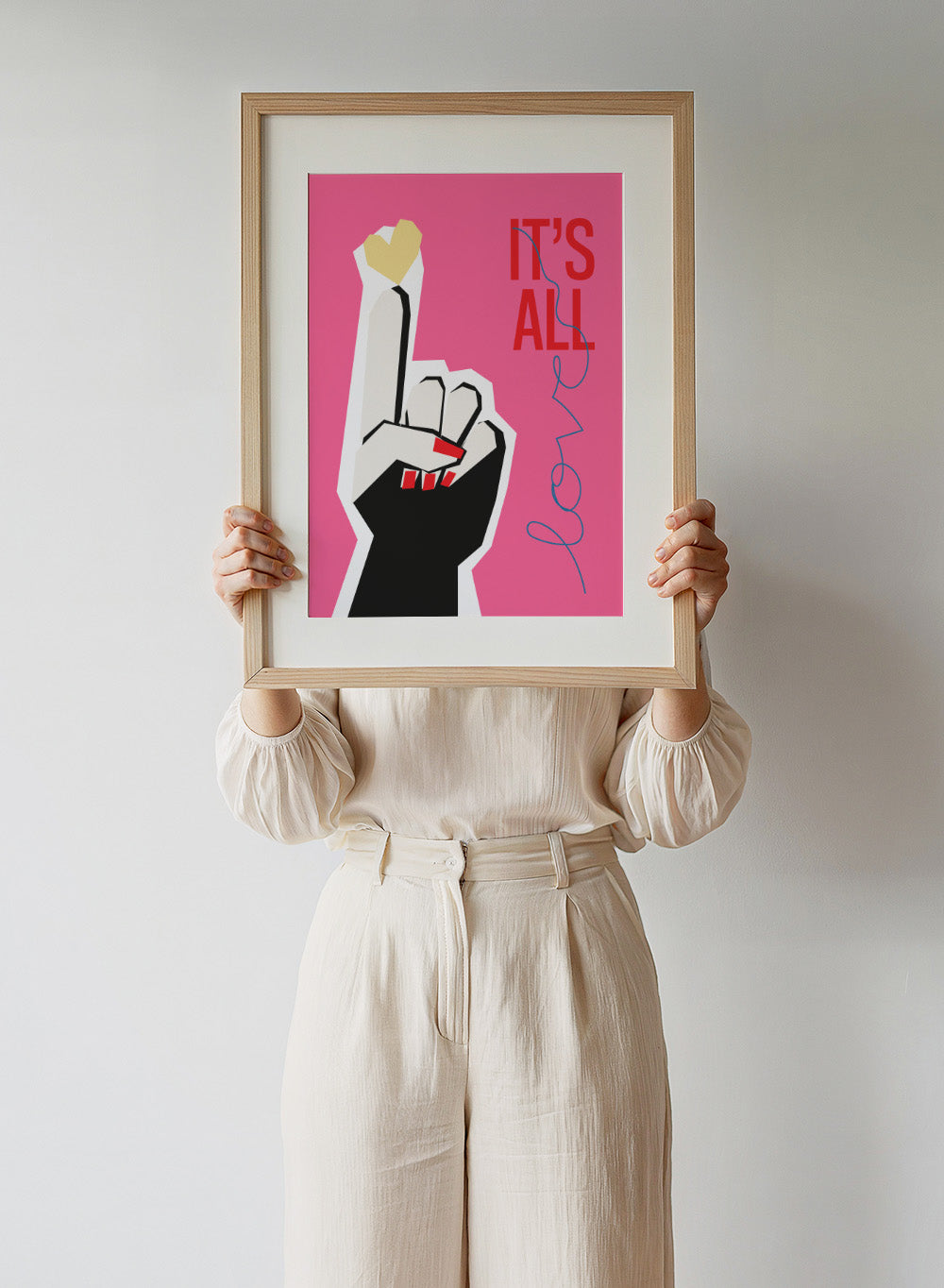 Illustration of a hand making a peace sign with text 'IT'S ALL LOVE' on a pink background. It’s All Love Hand Pink by Frances Collett is a modern graphic art print featuring an illustrated hand with heart symbol and bold typography. Officially licensed wall poster with optional framing.