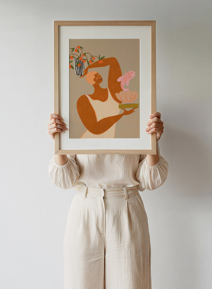 Illustration of a person holding a shell with a fish and a vase with flowers on a beige background. Fish and Oranges by Arty Guava is a modern surreal art print of a woman holding a fish with orange still life details. Officially licensed wall poster.