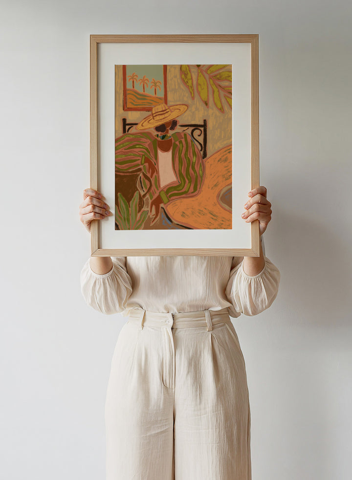 Artistic depiction of a person wearing a straw hat and patterned dress in a tropical setting. Lady in Stripe by Arty Guava art print featuring woman in straw hat and striped shirt with tropical palm landscape and warm contemporary illustration wall art poster.