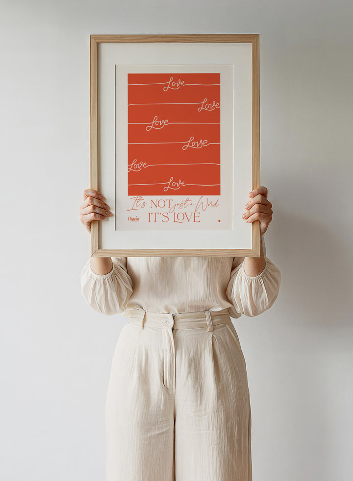 Red poster with 'Love' text and a quote on an orange background. About Love. One Word by Maria Galybina features bold typography and warm coral tones. Modern love quote art print and contemporary wall poster.