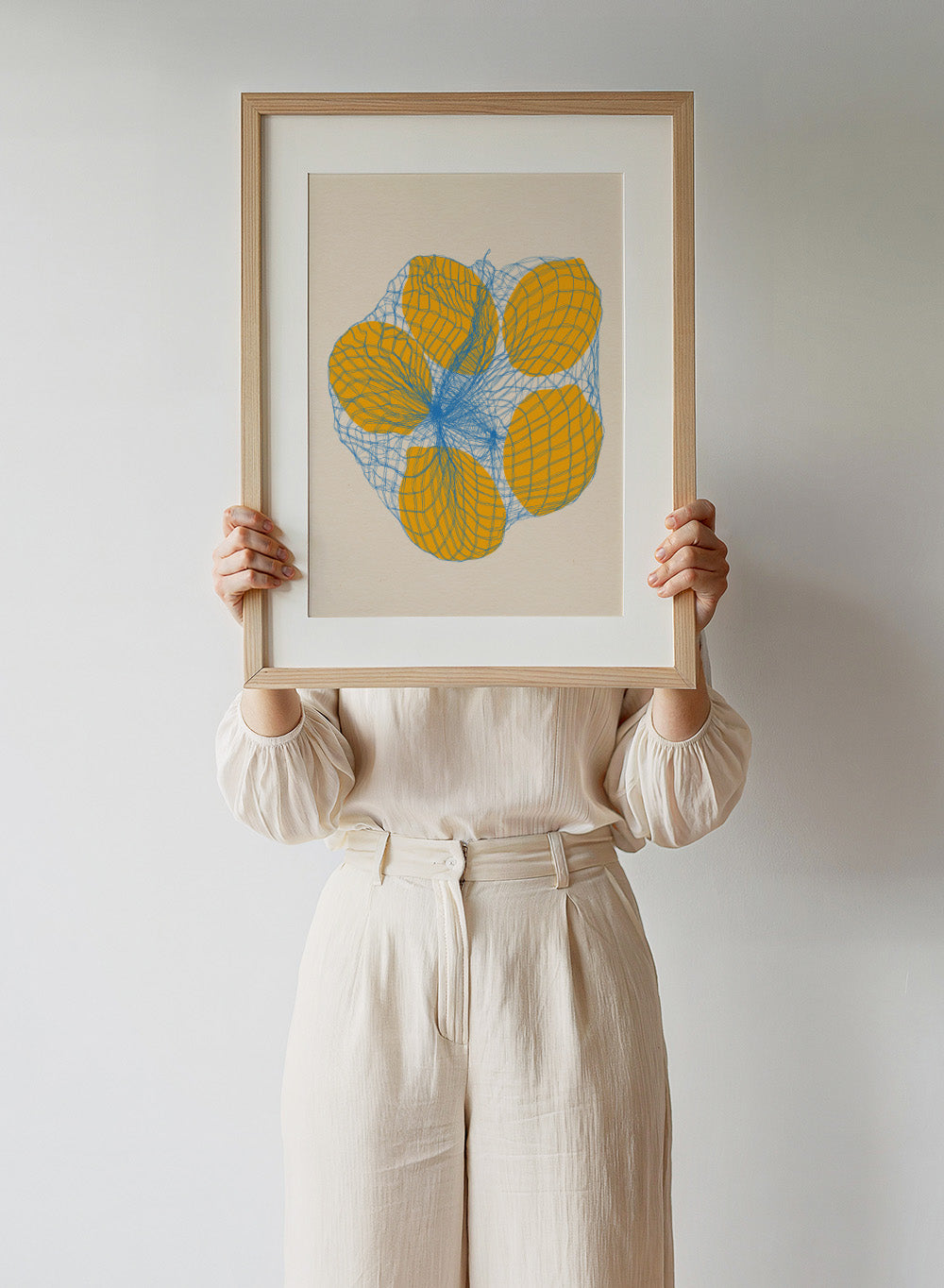 Geometric design with orange shapes and blue lines on a beige background. Five Lemons In a Net Bag by Rosi Feist is a modern minimalist fruit art print with Bauhaus design, officially licensed fine art poster.