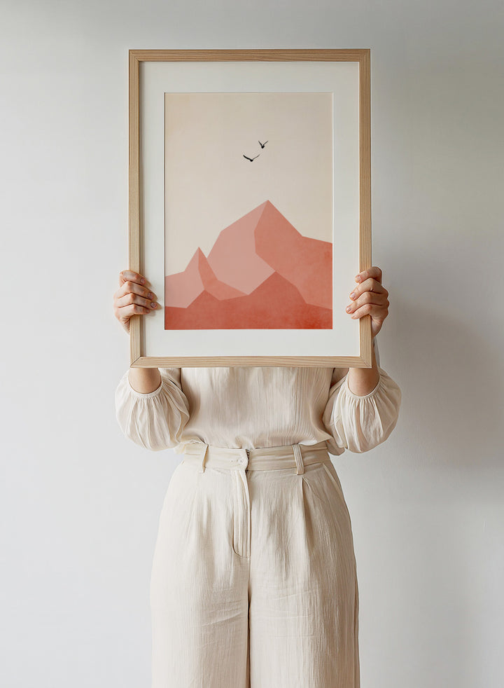 Abstract art print with geometric shapes and minimalistic birds on a beige background. Geometric mountain landscape art print with birds in flight by Kubistika. Warm terracotta illustration with minimalist design. Officially licensed wall poster.