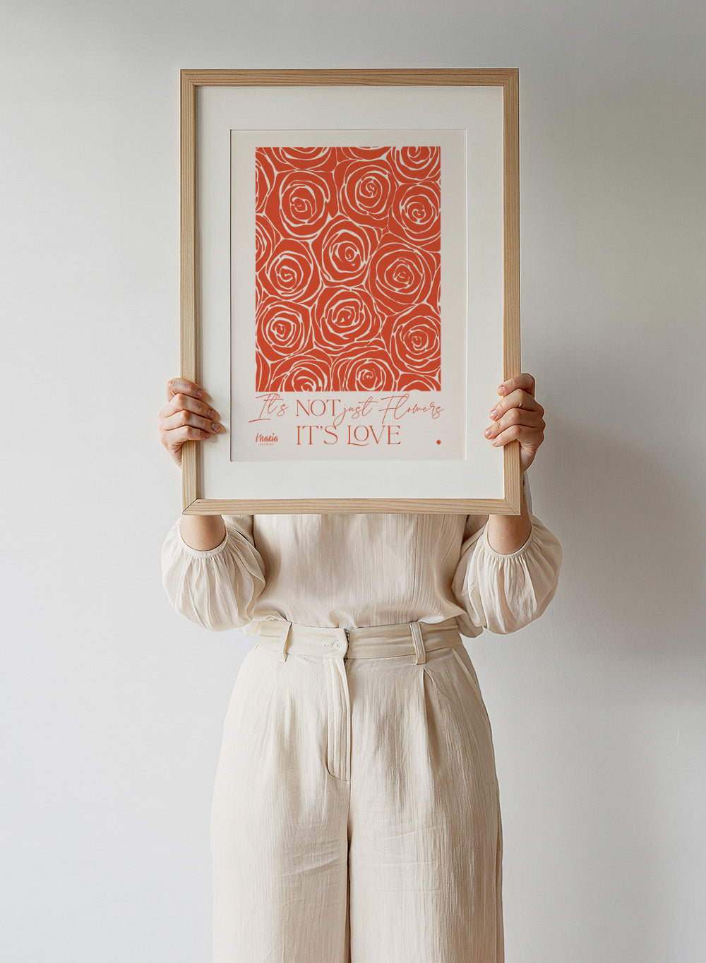 Pattern of red roses with text 'It's NOT just flowers IT'S LOVE' on a beige background. About Love. Smell of Roses by Maria Galybina is a floral art print with coral rose patterns and romantic typography. Modern love wall poster.