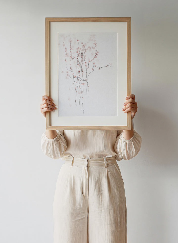 Art print of cherry blossom branches with pink flowers on a white background. Blooming Spring by Ankie Kooi art print featuring delicate pink blossoms, thin branches, watercolor florals, minimalist botanical illustration, soft nature wall poster.