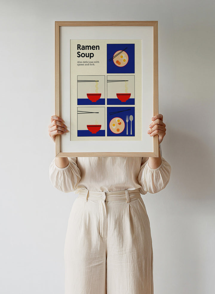 Illustration of ramen soup with chopsticks, a spoon, and fork on a blue background. Ramen Soup by Rosi Feist is a minimalist ramen art print with bold Bauhaus color, chopsticks, and playful humor. Officially licensed modern food poster.
