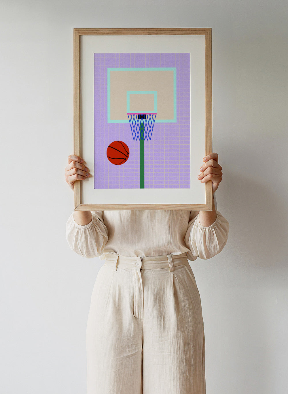 Basketball and hoop on a grid background. New York Basketball by Rosi Feist is a modern minimalist sports art print with bold graphic color and Bauhaus-inspired design. Officially licensed fine art poster with framing.