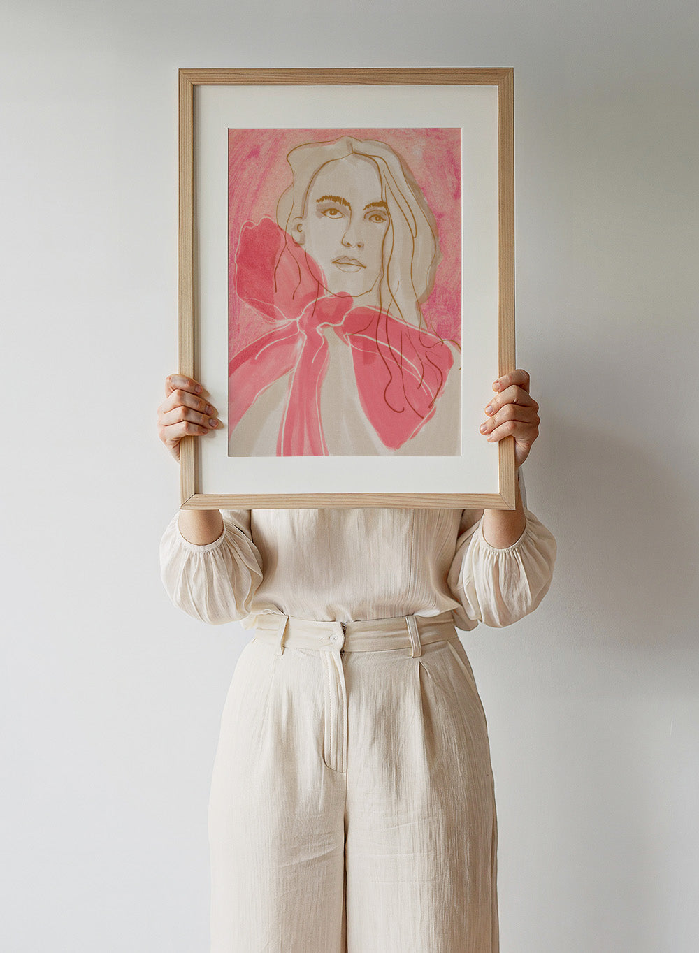 Artistic illustration of a woman with a pink bow tie on a pink background. Ethereal Red by Beate Tubach is a modern portrait art print featuring expressive linework and flowing red tones. A contemporary figurative wall poster.