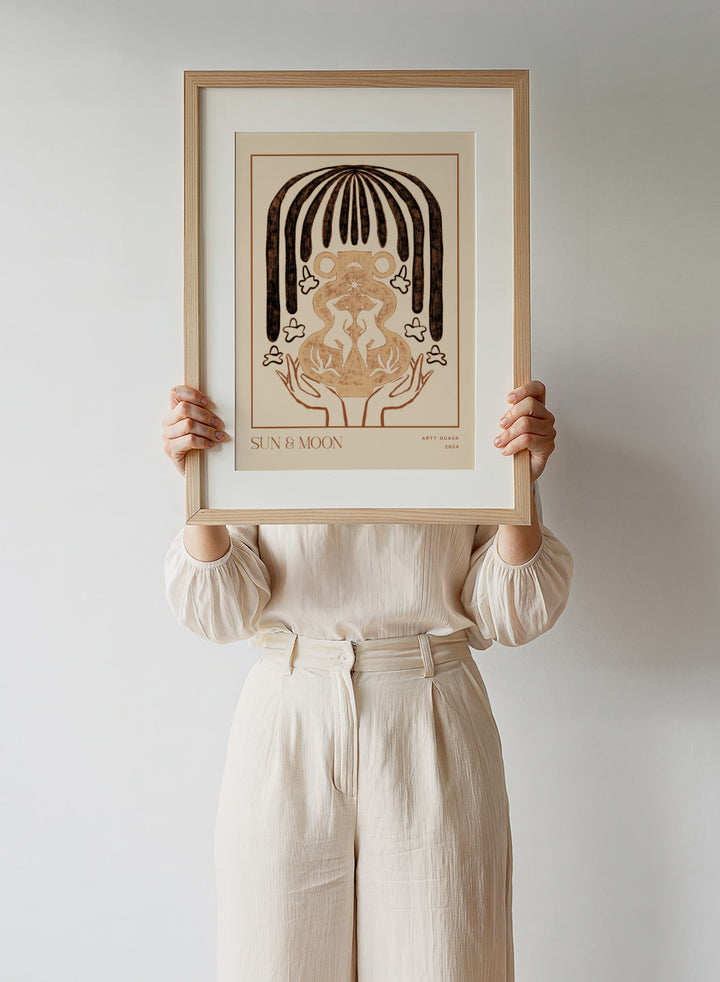 Artistic illustration of hands holding a symbol with 'Sun & Moon' text on a beige background. Vessel Collection: Sun & Moon by Arty Guava art print, modern vase wall poster with moon symbolism, contemporary minimalist line artwork.