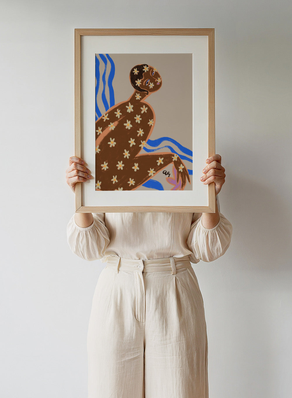 Artistic illustration of a person with floral patterns on a beige background. Blooming Daisy by Arty Guava is a modern woman floral art print with daisies and bold blue lines. Officially licensed contemporary wall poster.