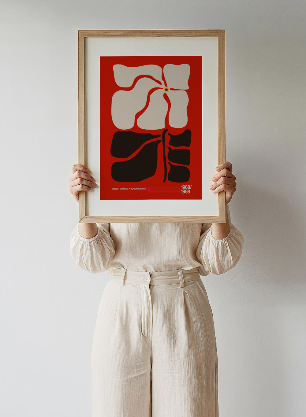 Abstract design with geometric shapes on a red background, featuring text at the bottom. English Gardens Red by Frances Collett features a bold illustrated flower with dark leaves on a red background. Officially licensed floral wall art print with optional framing.