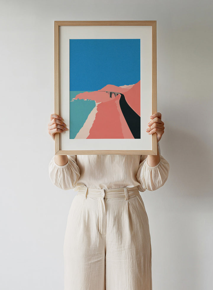 Artistic illustration of a coastal road with cliffs and blue sky. Pacific Coast Highway Big Sur by Rosi Feist is a modern minimalist landscape art print with bold color and Bauhaus-inspired graphic design. Officially licensed fine art poster with framing.