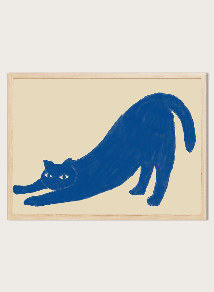 Framed wall art featuring a blue cat stretching on a beige background. Stretching Blue Cat by The Art Concept is a playful cat art print featuring a blue stretching cat on a warm cream background in a simple modern style.