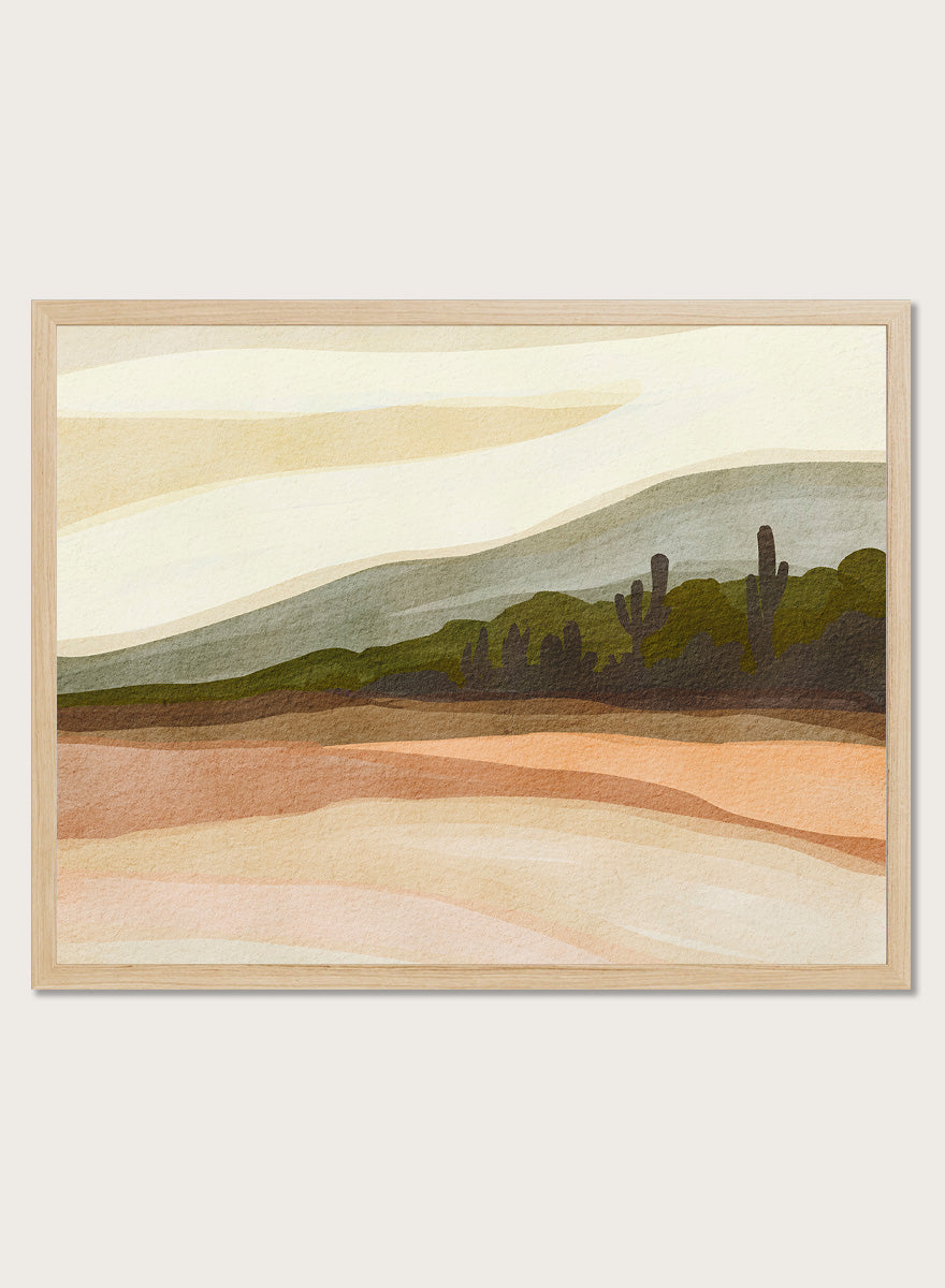 Shop Saguaro Desert Hills by Nikita Jariwala, a desert wall art print poster with saguaro cacti, layered hills, and warm sand, peach, olive, and cream tones.