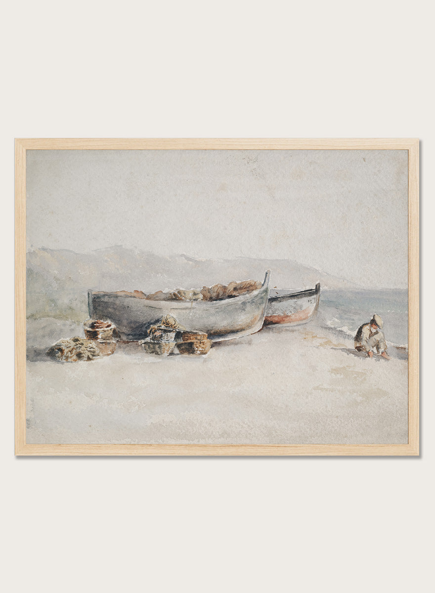 A framed watercolor painting depicting two boats on a sandy shore with rocks and a small seated figure. Fishing Boats on the Shore by Hercules Brabazon Brabazon is a vintage watercolor art print featuring fishing boats, nets, baskets, and a hazy coastal shore.