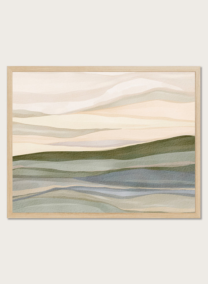 Framed abstract landscape wall art featuring layered hills and mountains in soft beige, cream, sage green, and muted blue tones. Shop Serene Rolling Hills by Nikita Jariwala, an abstract landscape wall art print poster featuring layered hills, distant mountains, and soft green tones.