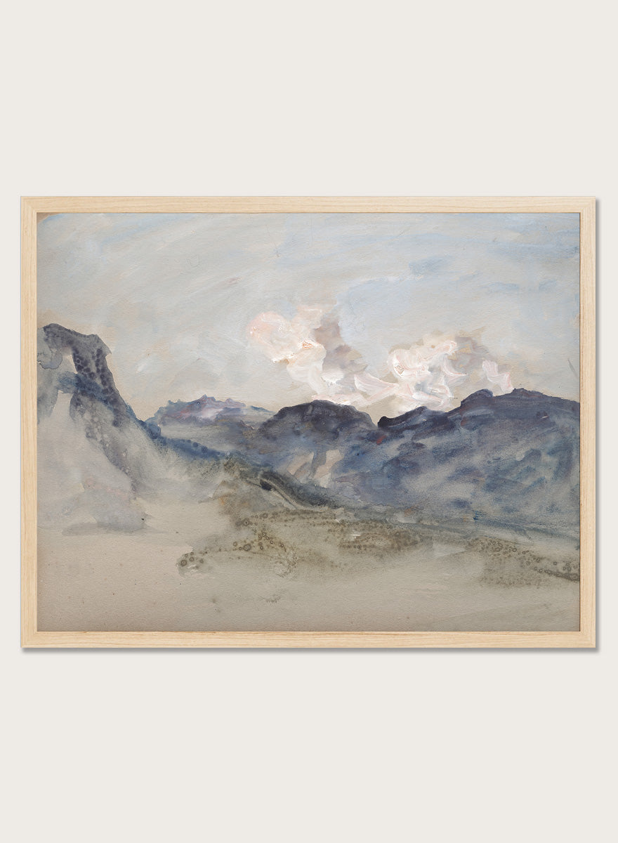 A framed landscape painting featuring blue and gray mountains under a pale sky with soft white clouds. In the Alps by Hercules Brabazon Brabazon is a vintage watercolor art print featuring snowy peaks, blue-grey mountains, soft clouds, and a misty alpine view.