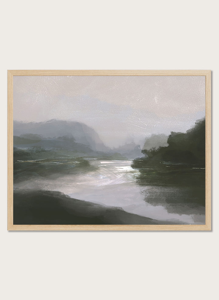 A framed landscape art print depicting a misty river scene with dark green hills, a reflective river, and a pale gray sky. Shop Tranquillitas by Dan Hobday, a contemporary landscape wall art print featuring reflective water, distant hills, dark green trees, and soft gray tones.