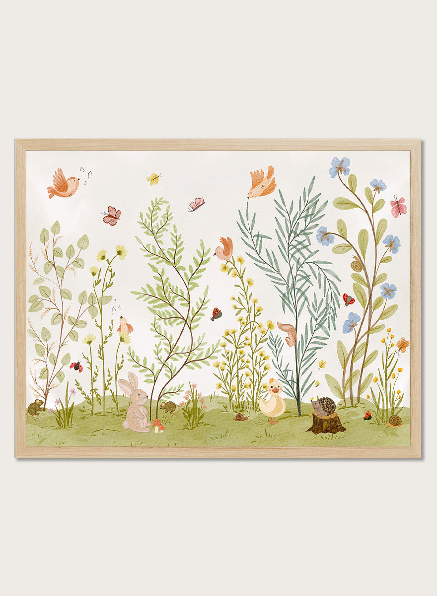 A framed art print featuring a whimsical, watercolor-style illustration of a garden with birds, butterflies, flowers, rabbits, and small animals on a light cream background. Shop Woodland Animal Friends by Nikita Jariwala, a woodland animal wall art print poster with rabbit, duck, hedgehog, butterflies, flowers, and green tones.