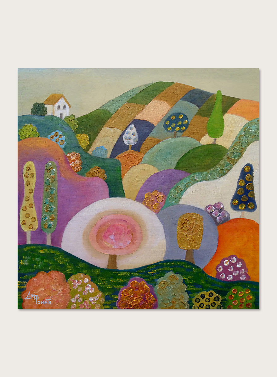 A colorful abstract landscape painting in a black frame, featuring stylized hills, trees, flowers, and a small house. The artwork has a playful, patchwork-like design with multiple vibrant colors including green, purple, orange, pink, blue, and yellow, set against a light beige wall. Shop Whimsical Hillside Village by Ángeles M. Pomata, a colorful landscape art print with rolling hills, patterned trees, and a dreamy village feel.