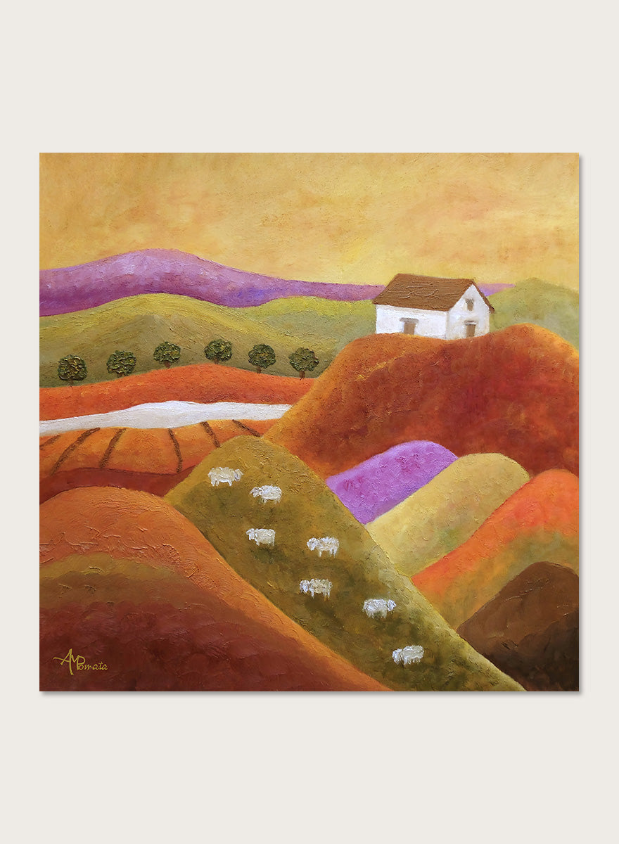 A framed landscape painting featuring rolling hills in warm earth tones, purple and green valleys, a small white house, and white sheep. Shop Pastoral Hills With Sheep by Angeles M. Pomata, an autumn countryside art print featuring rolling hills, grazing sheep, a white farmhouse, and warm earthy tones.