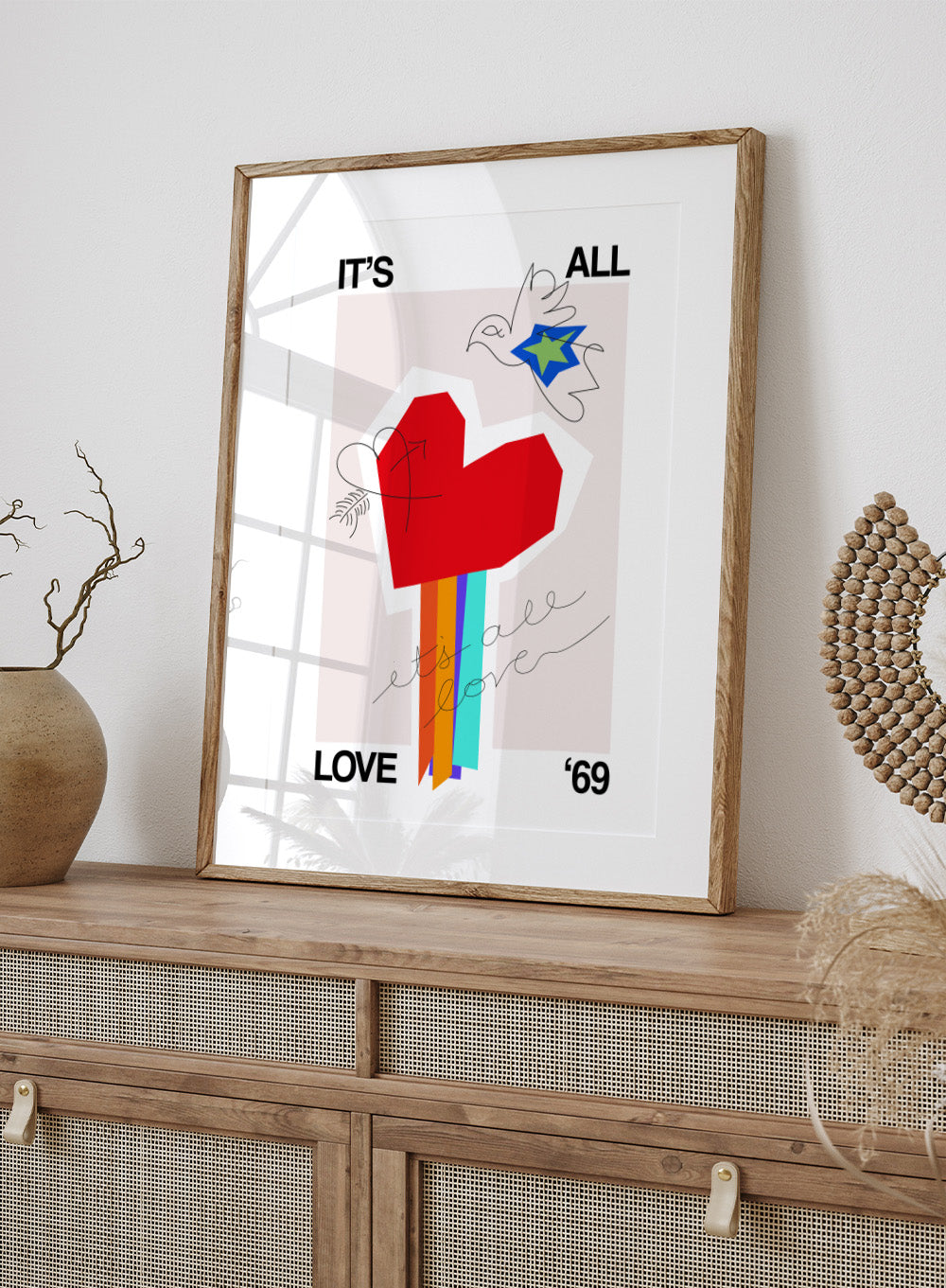 Colorful abstract design with a red heart and text on a light background. It’s All Love ’69 Heart Greige by Frances Collett is a colorful heart art print with rainbow stripes and expressive linework. Officially licensed contemporary wall poster with optional framing.