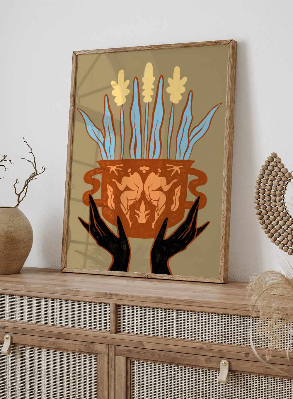 Decorative illustration of a vase with floral design and hands holding it, on a beige background. Vessel Collection: Growth by Arty Guava art print, modern vase wall poster with botanical illustration, contemporary minimalist line artwork.