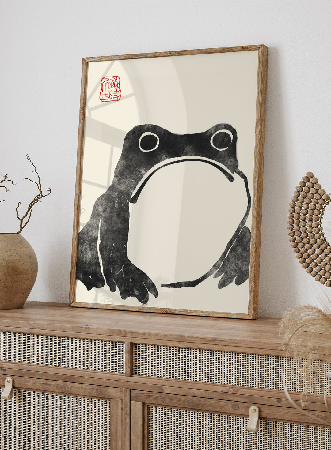 Inspired by Matsumoto Hoji 松本奉時 woodblock frog illustration, this Japanese poster art print showcases illustration of angry toad against beige background. Featuring a abstract black and beige frog drawing, this Japani vintage exhibition poster by Matsumoto Hoji is perfect for any boho, retro, minimalist, or Japani space.