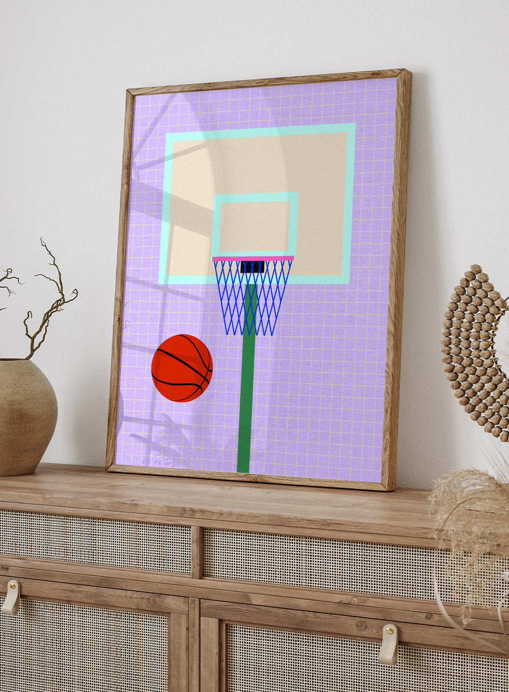 Basketball and hoop on a grid background. New York Basketball by Rosi Feist is a modern minimalist sports art print with bold graphic color and Bauhaus-inspired design. Officially licensed fine art poster with framing.