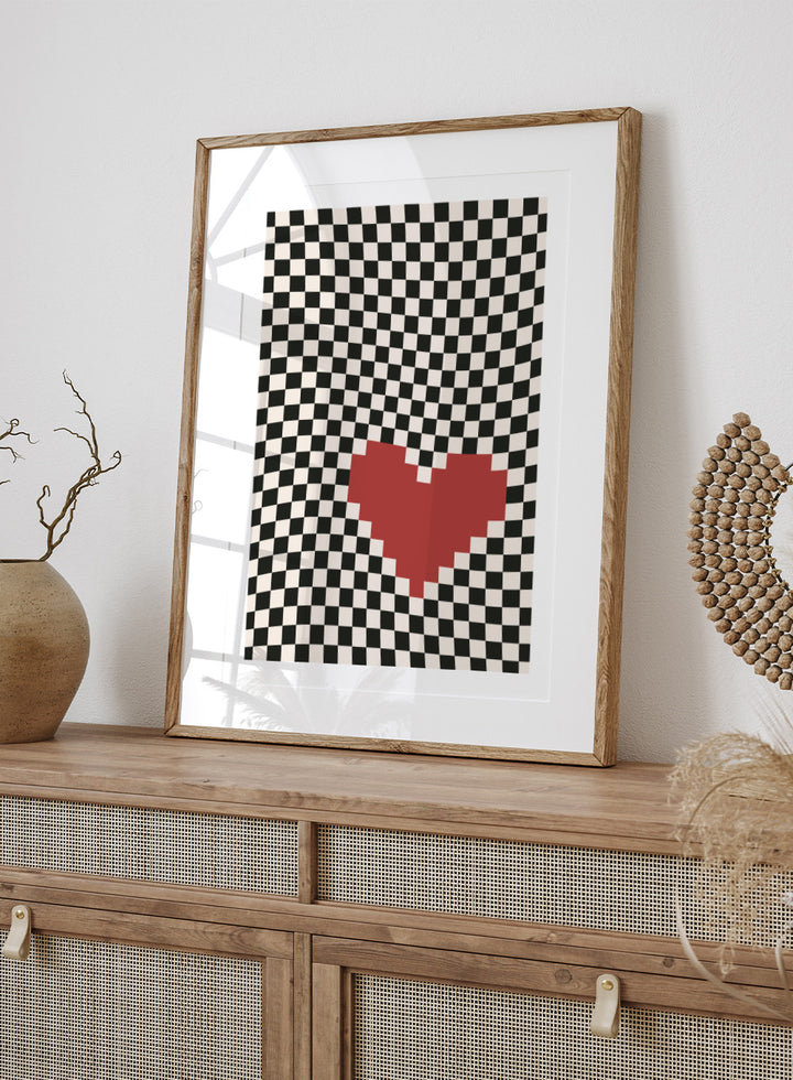 Checkered pattern with a red heart in the center. Pixel Heart by Frankie Kerr-Dineen features a red pixel heart on a wavy checkerboard background. Modern graphic art print and contemporary wall poster.
