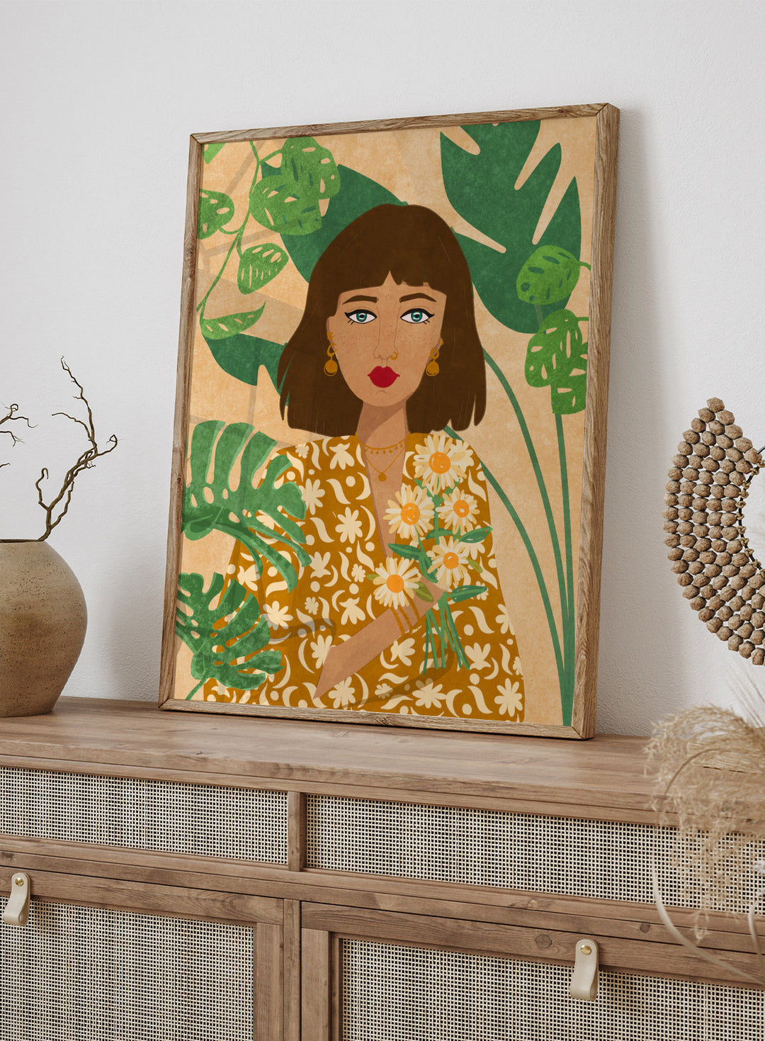 Illustration of a woman holding flowers with green leaves in the background. Plant Lady by Raissa Oltmanns fine art print featuring modern botanical woman portrait with daisies and green leaves, contemporary wall art poster.