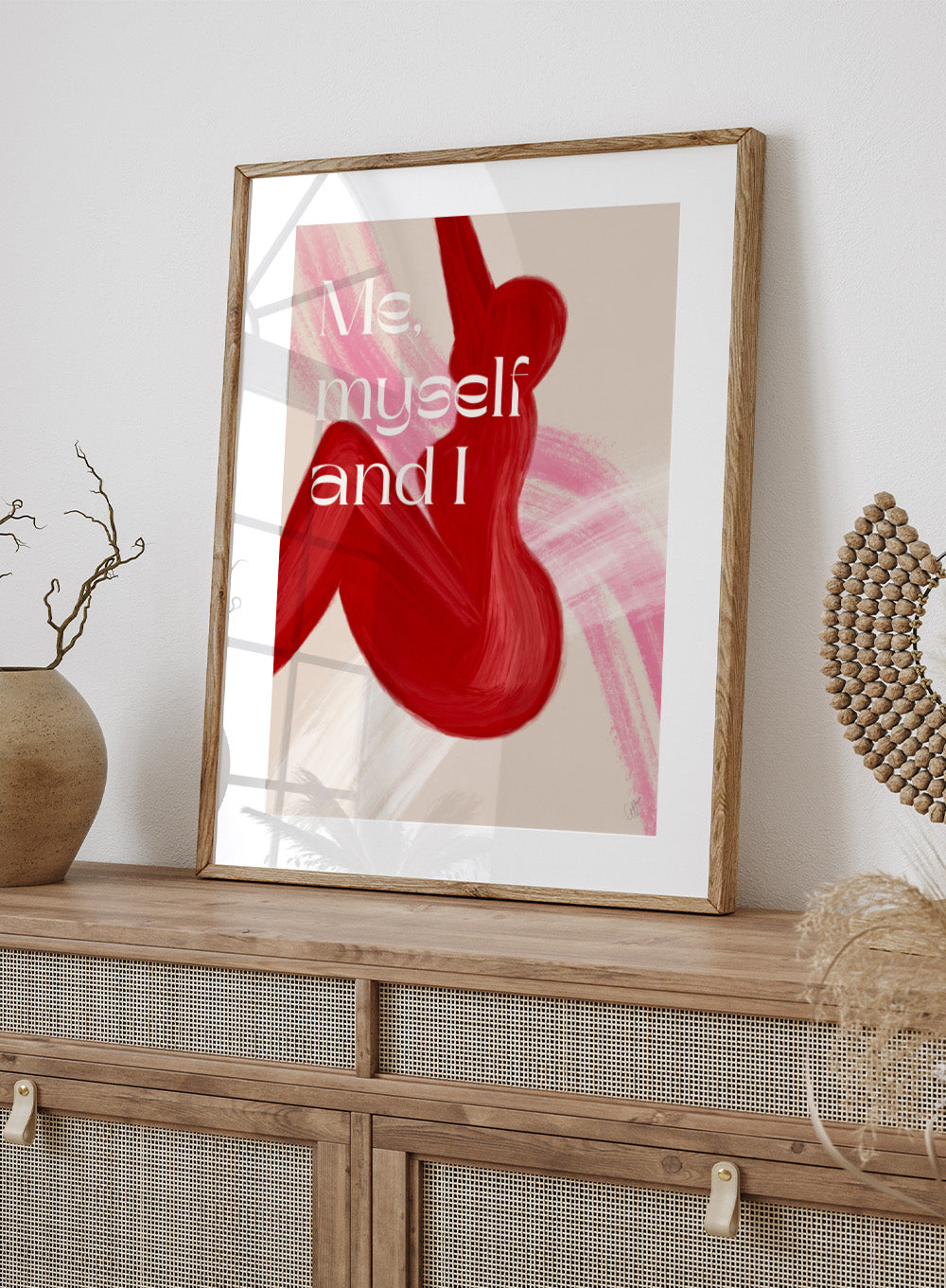 Abstract art with red shapes and 'Me, myself and I' text on a beige background. Red Woman by Anne-Marie Volfova is a modern figurative art print featuring bold red brushstrokes and empowering typography. Contemporary wall poster.