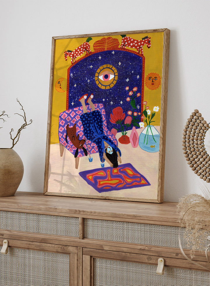 Colorful artwork of a person sitting on a chair with animals and decorative elements. Day Off From Office by Jota de Jai is a whimsical modern art print of a woman upside down with her dog, mid skincare routine, officially licensed wall poster with framing.