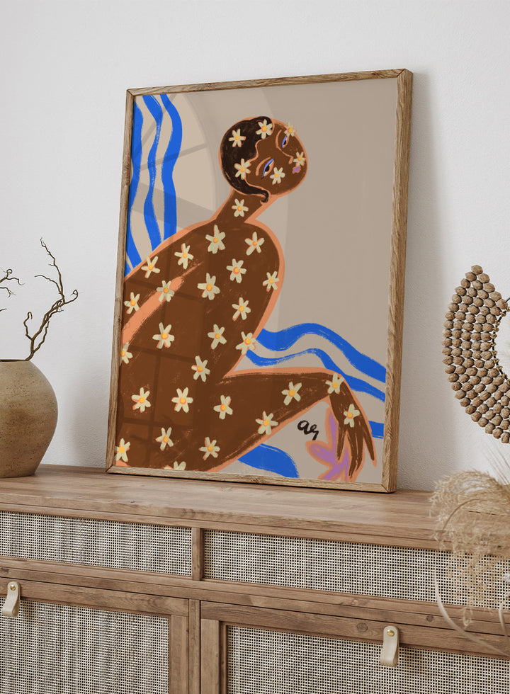 Artistic illustration of a person with floral patterns on a beige background. Blooming Daisy by Arty Guava is a modern woman floral art print with daisies and bold blue lines. Officially licensed contemporary wall poster.